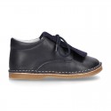 Little Classic Oxford style shoes with fringed design and flexible soles in combined leather.