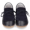 Little Classic Oxford style shoes with fringed design and flexible soles in combined leather.