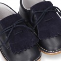 Little Classic Oxford style shoes with fringed design and flexible soles in combined leather.