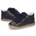 Little Classic Oxford style shoes with fringed design and flexible soles in combined leather.