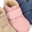 New suede leather little bootie sneaker style with fake hair lining and velcro strap.