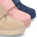 New suede leather little bootie sneaker style with fake hair lining and velcro strap.