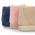 New suede leather little bootie sneaker style with fake hair lining and velcro strap.
