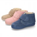 New suede leather little bootie sneaker style with fake hair lining and velcro strap.