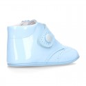 Little ankle boots for babies with velcro strap closure in patent leather.