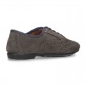 Classic Oxford laces up shoes in suede leather with ties closure.