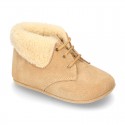 New Little desert boots for babies with fake hair lining and non slip sole in Suede leather.