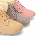 New Little desert boots for babies with fake hair lining and non slip sole in Suede leather.