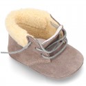 New Little desert boots for babies with fake hair lining and non slip sole in Suede leather.