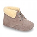 New Little desert boots for babies with fake hair lining and non slip sole in Suede leather.