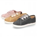 New serratex canvas FASHION tennis shoes with ties closure and chopped design.