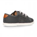 New serratex canvas FASHION tennis shoes with ties closure and chopped design.