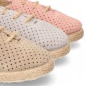 Suede leather Laces up style espadrille shoes with perforated design.