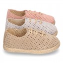 Suede leather Laces up style espadrille shoes with perforated design.