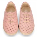 Suede leather Laces up style espadrille shoes with perforated design.