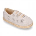 Suede leather Laces up style espadrille shoes with perforated design.