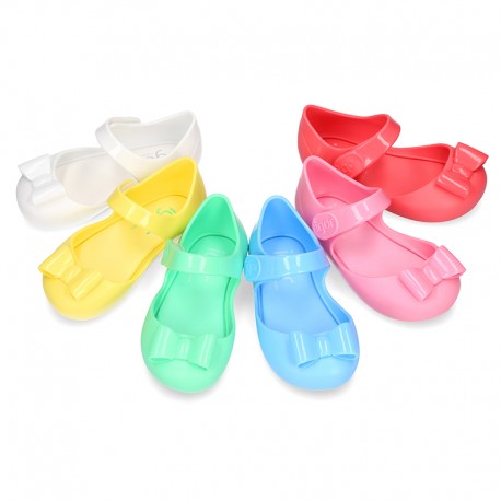 Jelly shoes Ballet flat style with ribbon and hook and loop strap.