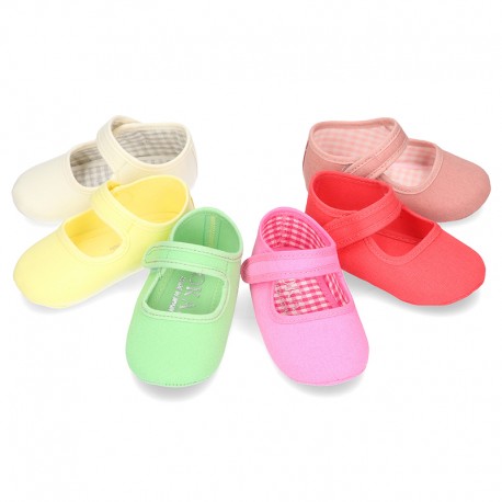 Cotton canvas baby little Mary Janes with velcro strap in seasonal colors.