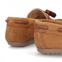 Moccasin shoes with tassels in suede leather color for kids.