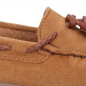 Moccasin shoes with tassels in suede leather color for kids.