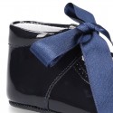 Patent leather little Mary Jane shoes for babies with ties closure.