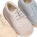 Classic Laces up shoes in pastel colors with chopped design in suede leather.