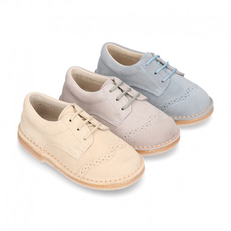 Classic Laces up shoes in pastel colors with chopped design in suede leather.