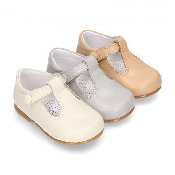 Classic Nappa leather T-strap shoes with velcro strap closure with button.