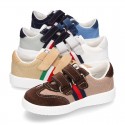 Combined canvas suede leather kids tennis shoes with hook and loop strap .