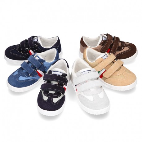 Combined canvas suede leather kids tennis shoes with hook and loop strap .