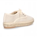 Laces up espadrille shoes in washing effect cotton canvas in pastel colors.