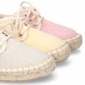 Laces up espadrille shoes in washing effect cotton canvas in pastel colors.