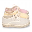 Laces up espadrille shoes in washing effect cotton canvas in pastel colors.