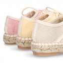 Laces up espadrille shoes in washing effect cotton canvas in pastel colors.