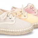 Laces up espadrille shoes in washing effect cotton canvas in pastel colors.
