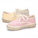 Laces up espadrille shoes in washing effect cotton canvas in pastel colors.