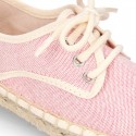 Laces up espadrille shoes in washing effect cotton canvas in pastel colors.