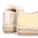 Laces up espadrille shoes in washing effect cotton canvas in pastel colors.