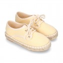 Laces up espadrille shoes in washing effect cotton canvas in pastel colors.