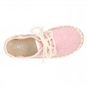 Laces up espadrille shoes in washing effect cotton canvas in pastel colors.