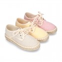 Laces up espadrille shoes in washing effect cotton canvas in pastel colors.