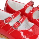 Classic little Mary Jane shoes in RED patent leather with double buckle fastening and perforated design.