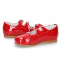 Classic little Mary Jane shoes in RED patent leather with double buckle fastening and perforated design.