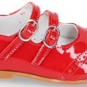 Classic little Mary Jane shoes in RED patent leather with double buckle fastening and perforated design.