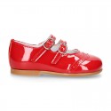 Classic little Mary Jane shoes in RED patent leather with double buckle fastening and perforated design.