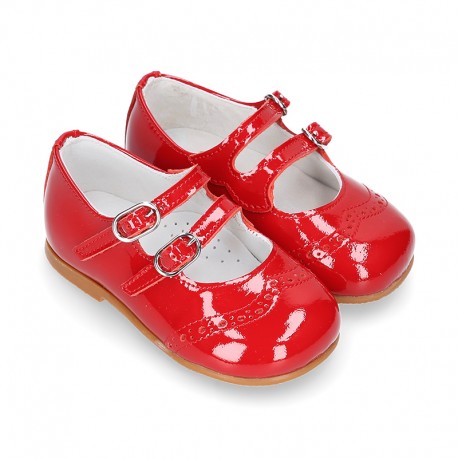 Classic little Mary Jane shoes in RED patent leather with double buckle fastening and perforated design.