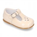 Little T-Strap shoes with perforated design in patent leather in pastel colors.