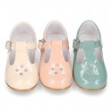 Little T-Strap shoes with perforated design in patent leather in pastel colors.