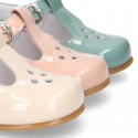 Little T-Strap shoes with perforated design in patent leather in pastel colors.