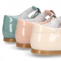 Little T-Strap shoes with perforated design in patent leather in pastel colors.